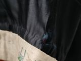 a person that is holding a bag with some stuff inside of it