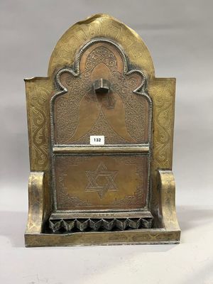 an image of a brass plate with a clock on top of it