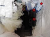 a picture of a pile of trash in a trash can