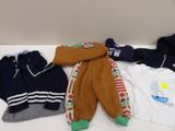 a pile of clothing that is on a table