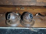 two pairs of shoes that are sitting on the floor