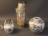 three vases and a teapot sitting next to each other