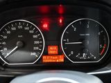 a close up of a car dashboard with a speedometer and gauges
