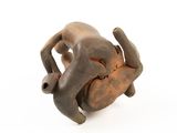 an image of a figurine of a man laying on his back