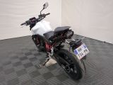 a picture of a motorcycle parked on a checkered floor