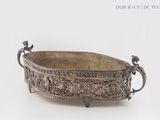 an antique silver plate with handles and handles on a white background
