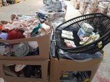 two boxes of clothes and a chair in a warehouse