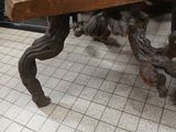 a wooden bench that is sitting on a tiled floor