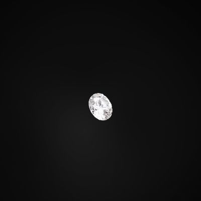 un gros plan d'un diamant blanc sur fond noir