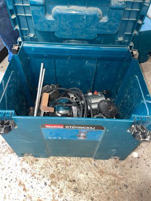 a blue tool box with tools in it on the floor