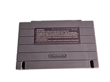 a gray nintendo game console sitting on top of a white table