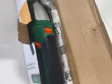 a box with a green and black glue gun inside of it