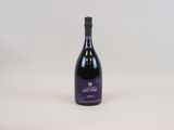 a bottle of wine that is sitting on a table