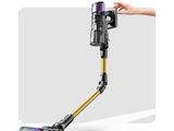 a person using a cordless vacuum cleaner to clean the floor
