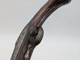 a close up of a cane with a wooden handle