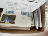 a box full of postcards sitting on top of a table