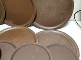 many plates and pans sitting on a table