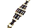 a close up of a gold and black bracelet on a white background