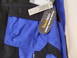 the pants are blue and black with a tag on them