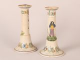 two vases that have been painted with people on them