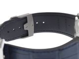 a close up of a watch on a white surface with a blue strap