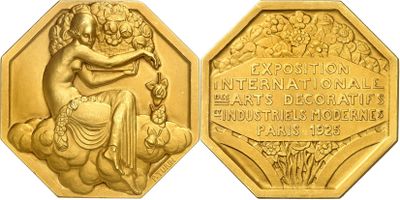 a close up of a gold coin with a statue on it