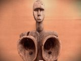 a statue of a man with two eyes on it ' s head