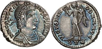 a silver coin with an image of a man holding a sword