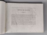 an open book with a page in it on a table