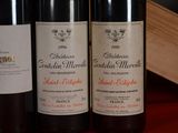 three bottles of wine sitting next to each other on a table