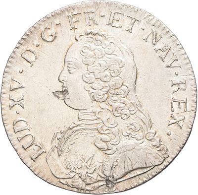 a silver coin with an image of a man in profile