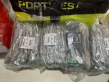 a pile of cell phones that are wrapped in plastic
