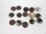 a lot of buttons that are sitting on a table