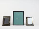three different frames are sitting next to each other on a white surface