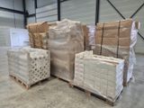 boxes and pallets are stacked on pallets in a warehouse