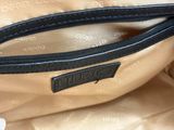 the inside of a purse with a zipper on the inside