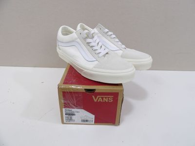 vans old skooler sneakers in white with white laces on top of a box