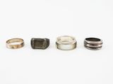 three different types of rings sitting on top of a white surface