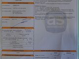 a picture of a receipt on a refrigerator door