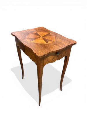 an image of a wooden table with a geometric design on it
