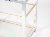 an image of a glass and metal bar cart