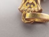 a gold plated ring with a masonic symbol on it