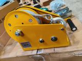 a box that has a yellow winch on top of it