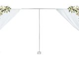 a white wedding arch decorated with white flowers and greenery