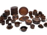 many different types of brown dishes and cups