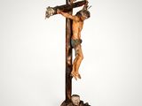 a close up of a statue of a person on a cross