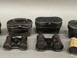 several different types of binoculars are lined up on a table