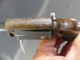 a person holding a gun in their hand