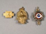 two gold medals and a gold medal on a white surface