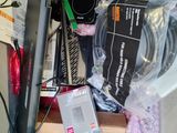 a pile of electronic equipment sitting on top of a table